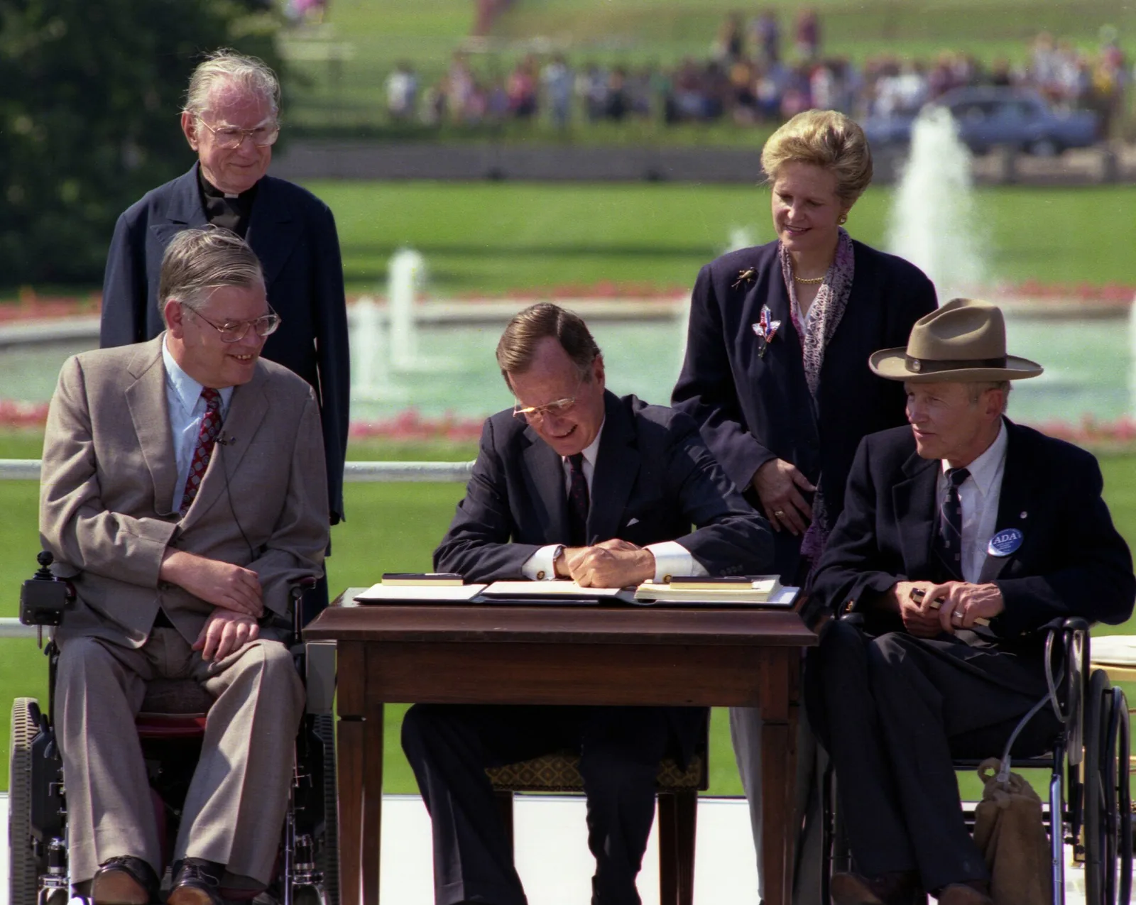 President George H. W. Bush signing the Americans with Disabilities Act on the White House South Lawn in 1990.